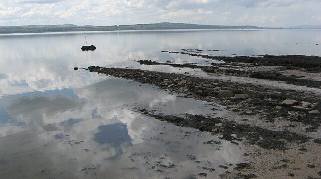Rocks off Limekilns Rocks drying at low water, seen from the pier at Bruce Haven.