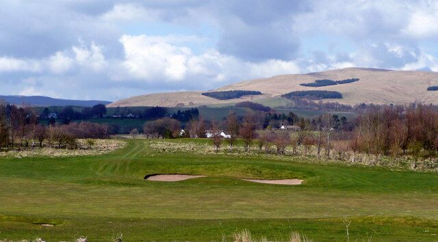 Muckhart Golf Course The bunkers are mirrored by the patches of forest up on the Ochils.