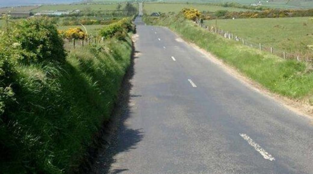 The straight to Kilmory Arran is not noted for straight roads. This is straight for over a mile - at least in two dimensions. The Mull of Kintyre can be seen faintly in the distance, over Kilbrannan Sound