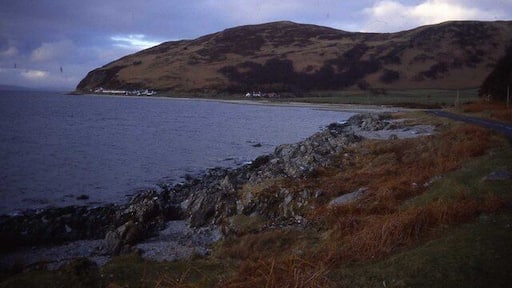 Shoreline at Catacol Bay Looking northwards across the bay to Catacol hamlet which is dwarfed by Cnoc Leacainn Duibne.