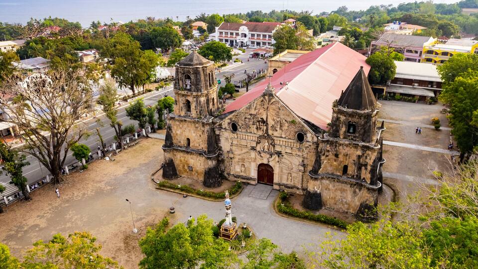 Aerial of Miagao Church and the surrounding town proper. Also known as the Santo Tomás de Villanueva Parish Church