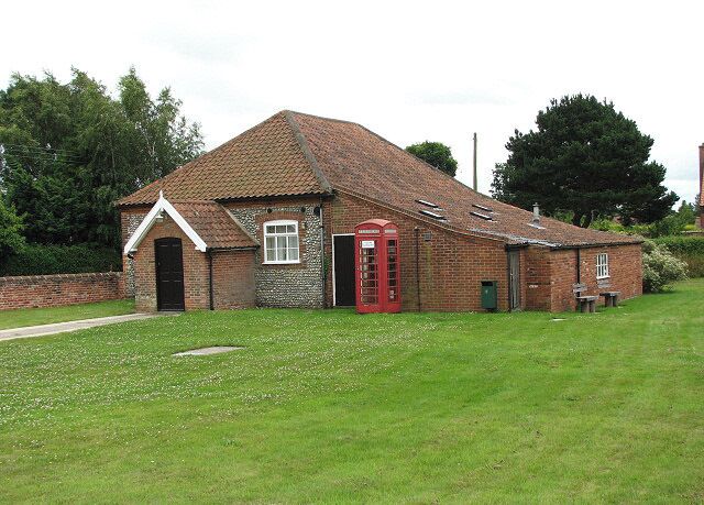 Village hall and red telephone box. The village hall is situated on the green beside the B1149 (Norwich Road) > 877231.