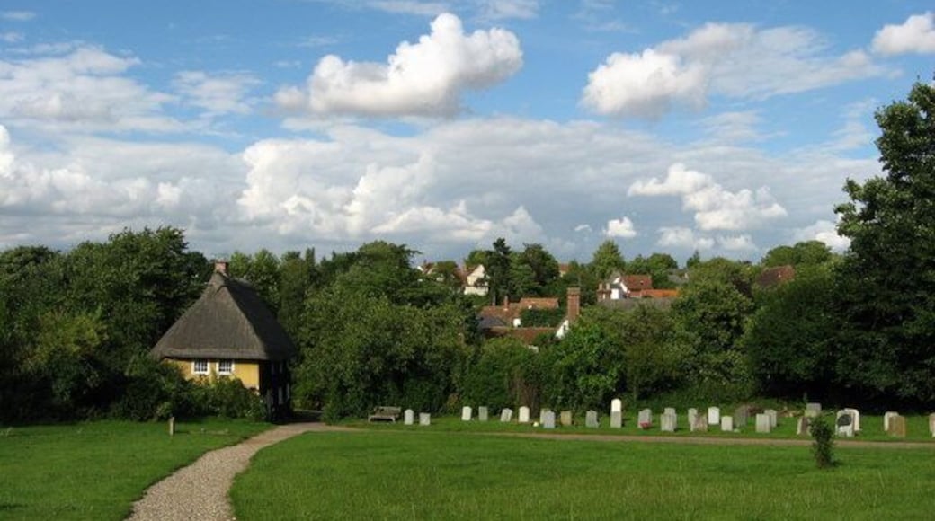 View from the church The church of St Botolph is approached via a narrow lane bordered by cottages and a hedgerow.