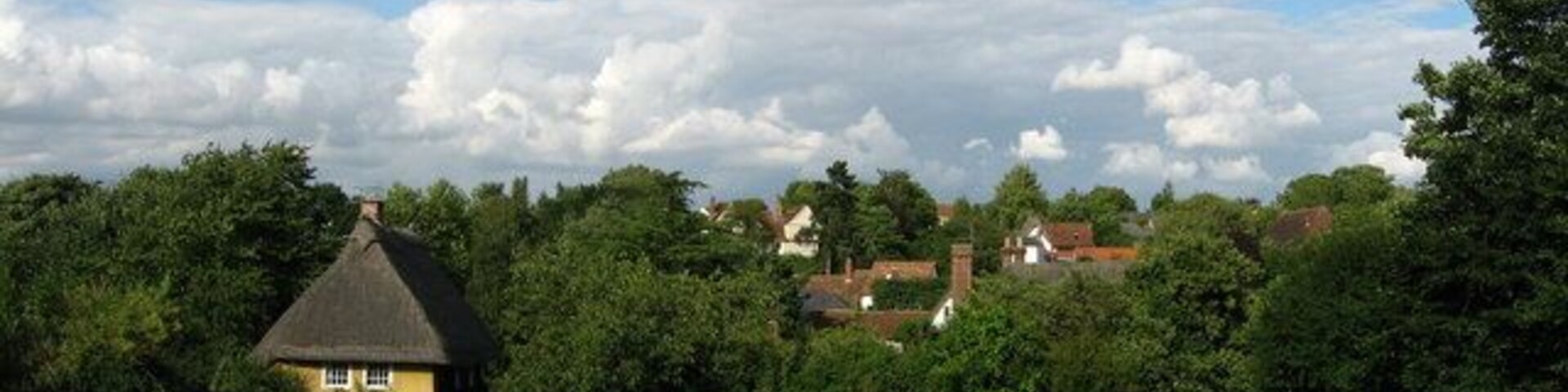 View from the church The church of St Botolph is approached via a narrow lane bordered by cottages and a hedgerow.