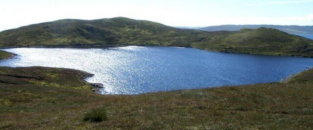 A lake surrounded by hills.
