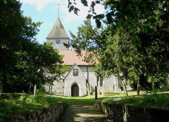 Church of Saints Peter and Paul, Lynsted. The gable of the south porch has a sun dial which bears the legend "Every moment well improved secures an age in Heaven."