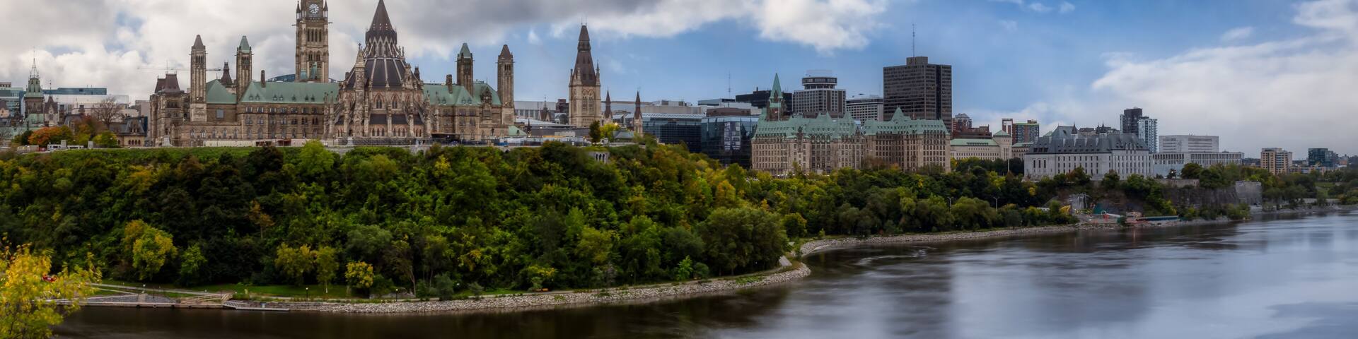 Panoramic view of Downtown Ottawa and the Parliament of Canada. Taken from Nepean Point, Ontario, Canada. Colorful Dramatic Sky Artistic Render