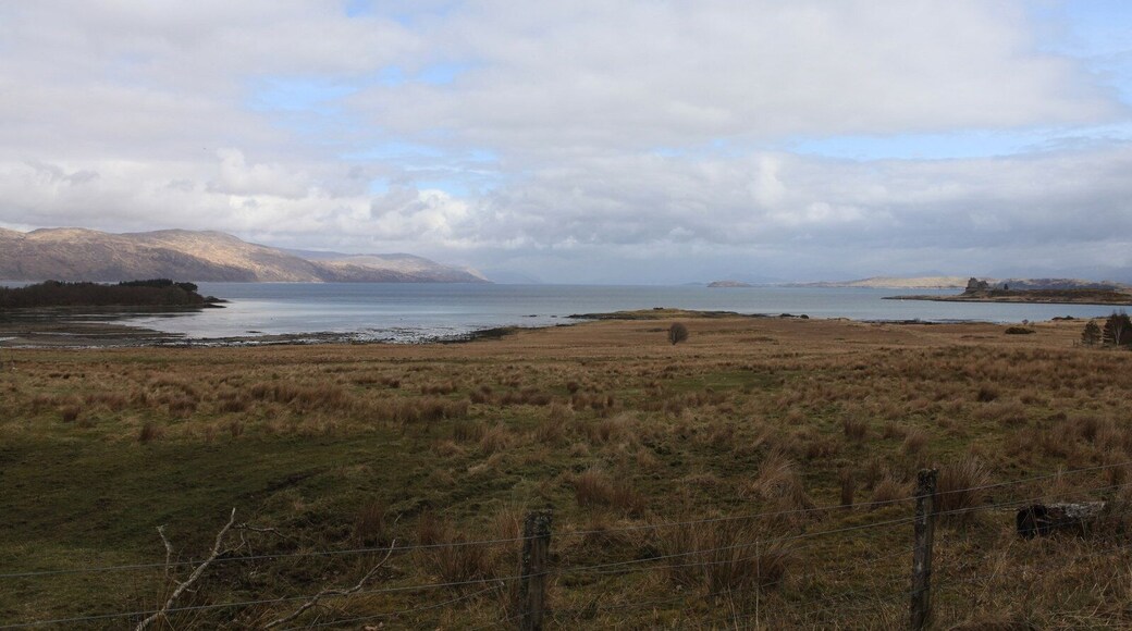 View over Eilean Trianach The bay to the left is Camas Mor (large bay in Gaelic), the bay on the right is Duart Bay (an even larger Bay). In the distance is Loch Linnhe. The Island behind Duart Castle to the right of the picture is Lismore.