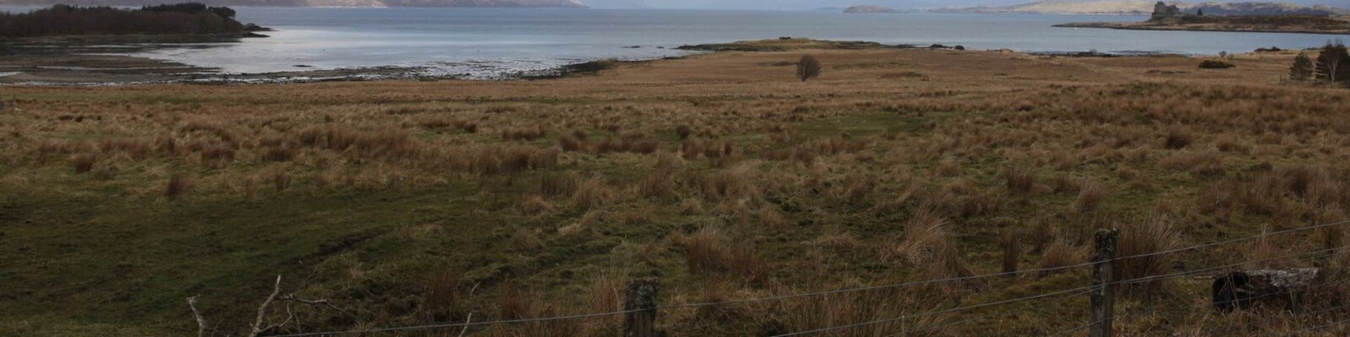 View over Eilean Trianach The bay to the left is Camas Mor (large bay in Gaelic), the bay on the right is Duart Bay (an even larger Bay). In the distance is Loch Linnhe. The Island behind Duart Castle to the right of the picture is Lismore.