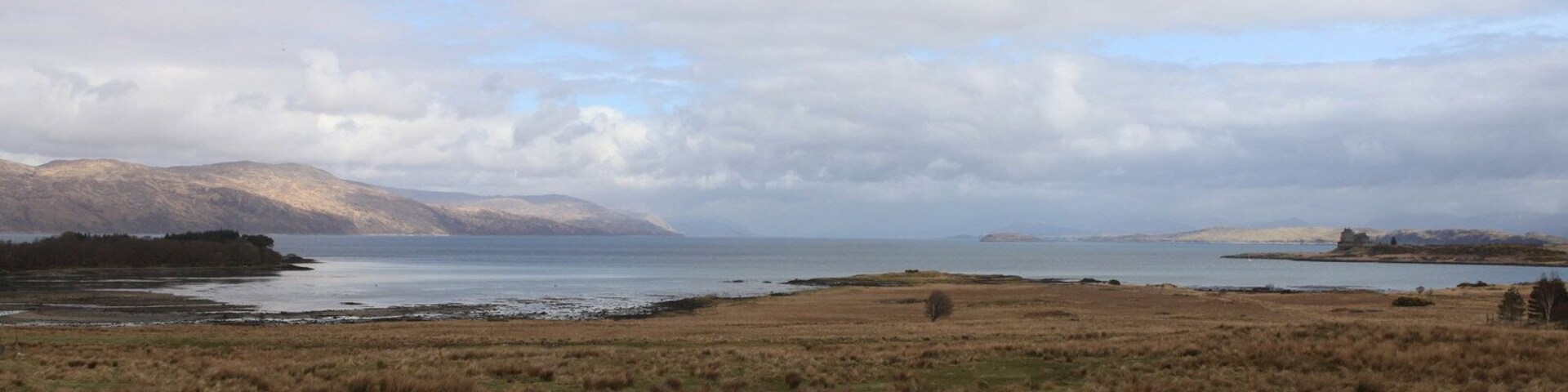 View over Eilean Trianach The bay to the left is Camas Mor (large bay in Gaelic), the bay on the right is Duart Bay (an even larger Bay). In the distance is Loch Linnhe. The Island behind Duart Castle to the right of the picture is Lismore.