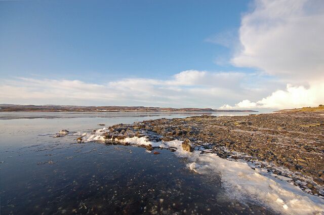 Frozen sea at the mouth of Loch Eyre Just at the mouth of Loch Eyre where it joins Loch Snizort Beag, thin sheets of ice pile up on the shore as the tide flows out of the loch.