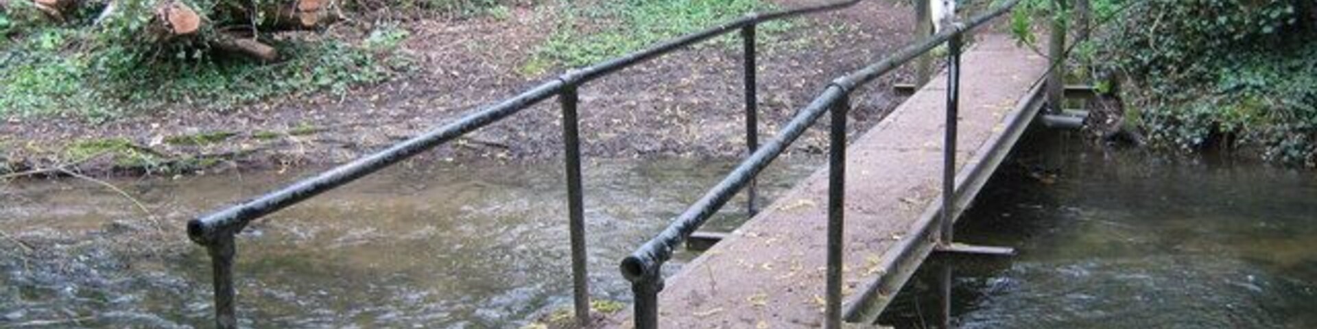Footbridge over River Darenth (righthand side) The river form Horton Kirby/South Darenth flows towards Dartford and the Thames. But at Sutton at Hone it divides to go around an island with St John's Jerusalem (National Trust House) on. This footbridge is on a footpath from Roman Villas Road, to Main Road, Sutton at Hone.