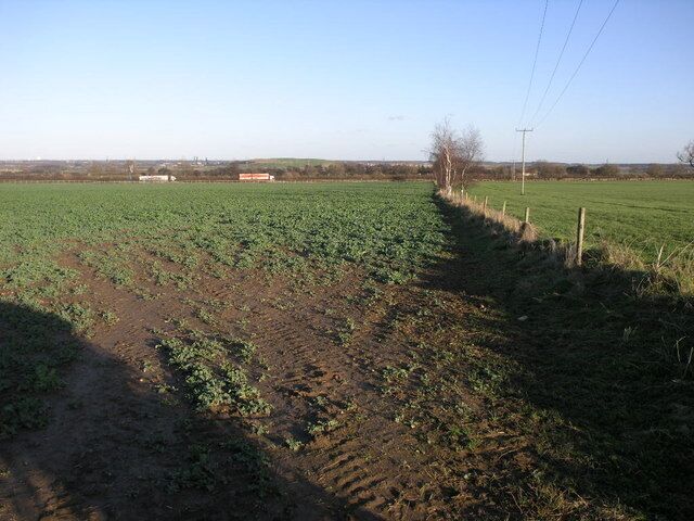 Fields and Motorway The lorries passing by these fields are heading south on the A1(M) just south of its junction with the M18.