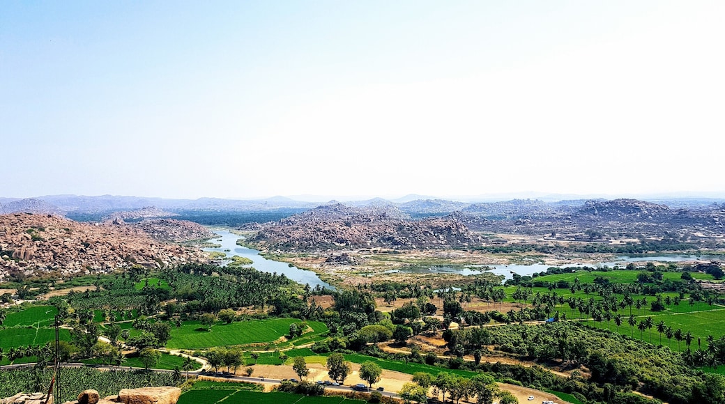 Cross over the river in Hampi to visit the 'hippie island.' Hire a scooter and drive past vibrant rice fields seeking temples. An incredible view of the boulder strewn landscape with its ancient temples and winding river can be seen at the top of Anjaneya Temple.
#india #temples #hampi #landscapes