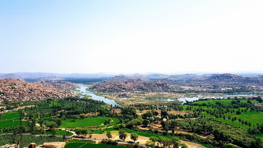 Cross over the river in Hampi to visit the 'hippie island.' Hire a scooter and drive past vibrant rice fields seeking temples. An incredible view of the boulder strewn landscape with its ancient temples and winding river can be seen at the top of Anjaneya Temple.
#india #temples #hampi #landscapes