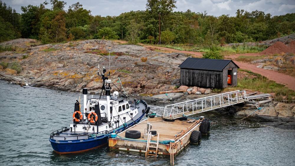 Aland Islands, Finland, Mariehamn, Sottunga August 2019: berth of the island and tug moored to the port of sottung on the Parking lot, moored ship.