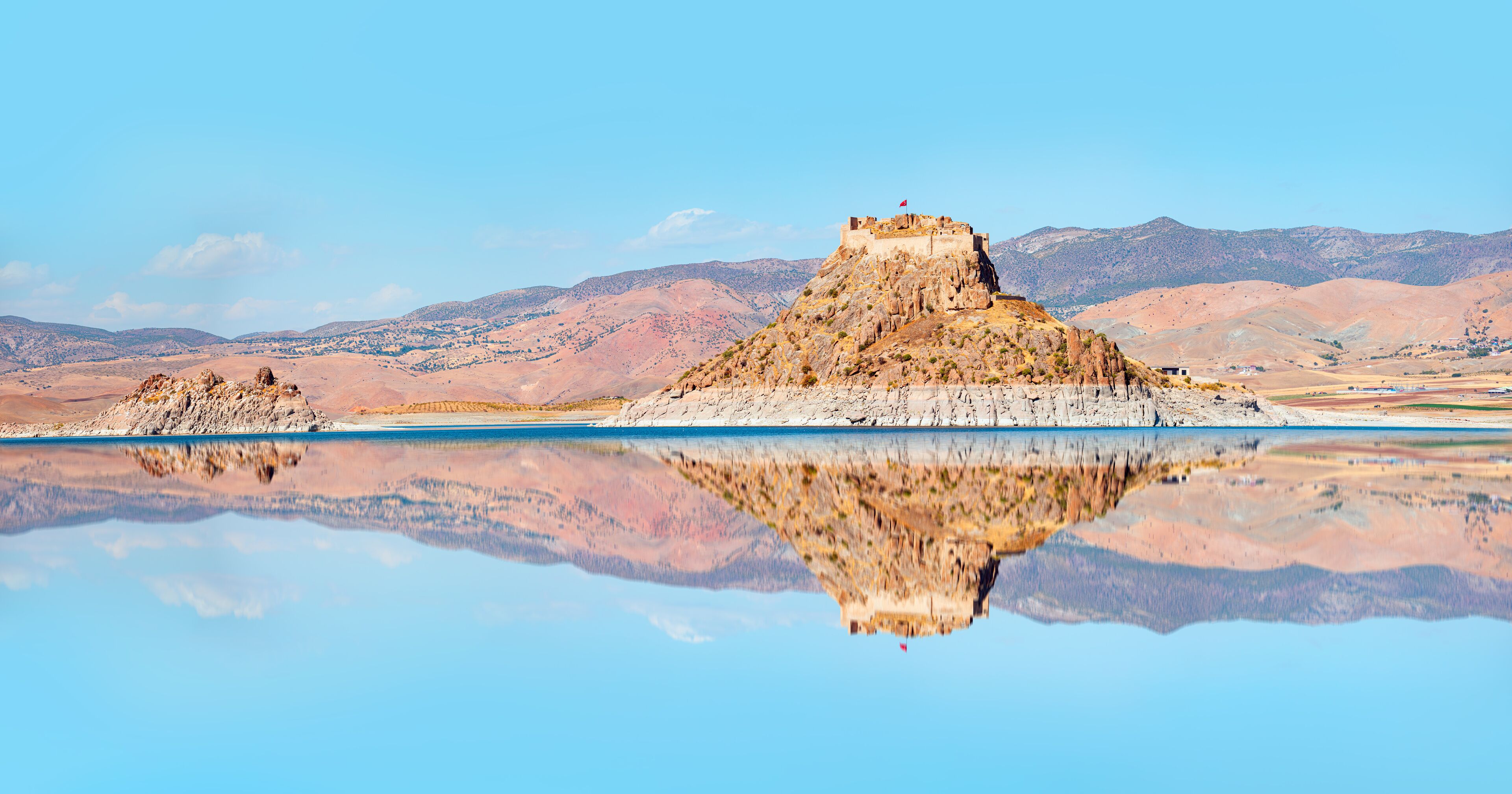 Pertek castle located in Pertek district of Tunceli - Pertek, Turkey Keban dam lake in the foreground