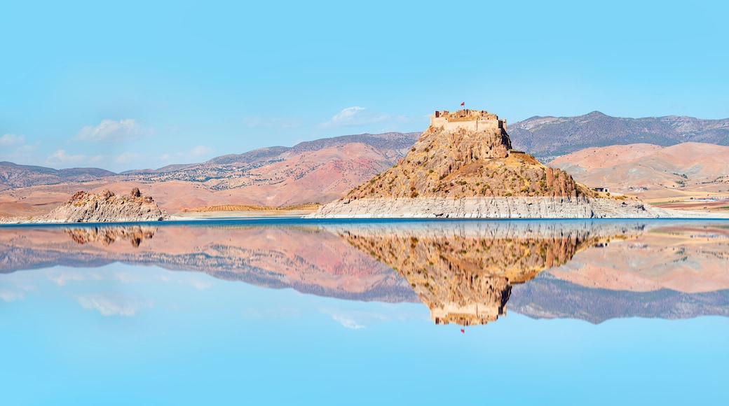 Pertek castle located in Pertek district of Tunceli - Pertek, Turkey Keban dam lake in the foreground