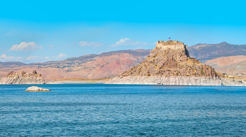 Pertek castle located in Pertek district of Tunceli - Pertek, Turkey Keban dam lake in the foreground