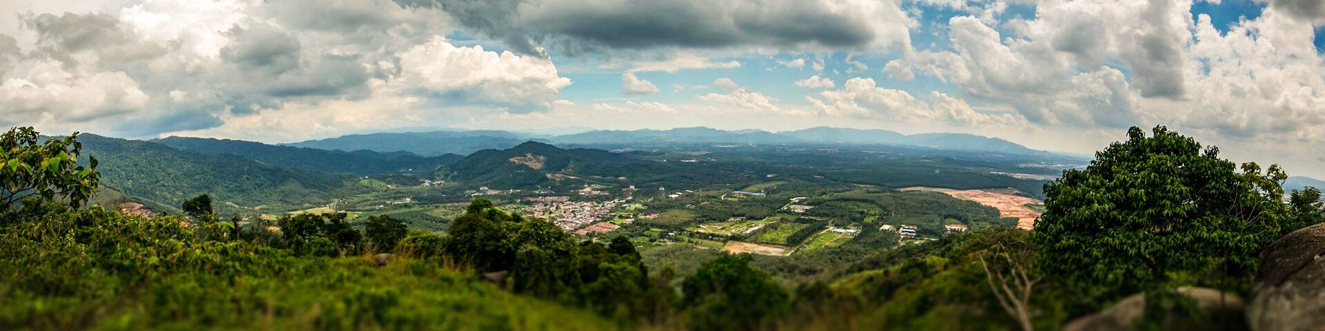 On the top of Broga Hill, Selangor, Malaysia. Tilt shift view over the Landscape of Selangor from top of the mountains. Aerial view over the wide horizon. Blue Sky and white clouds