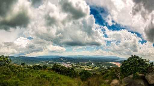 On the top of Broga Hill, Selangor, Malaysia. Tilt shift view over the Landscape of Selangor from top of the mountains. Aerial view over the wide horizon. Blue Sky and white clouds