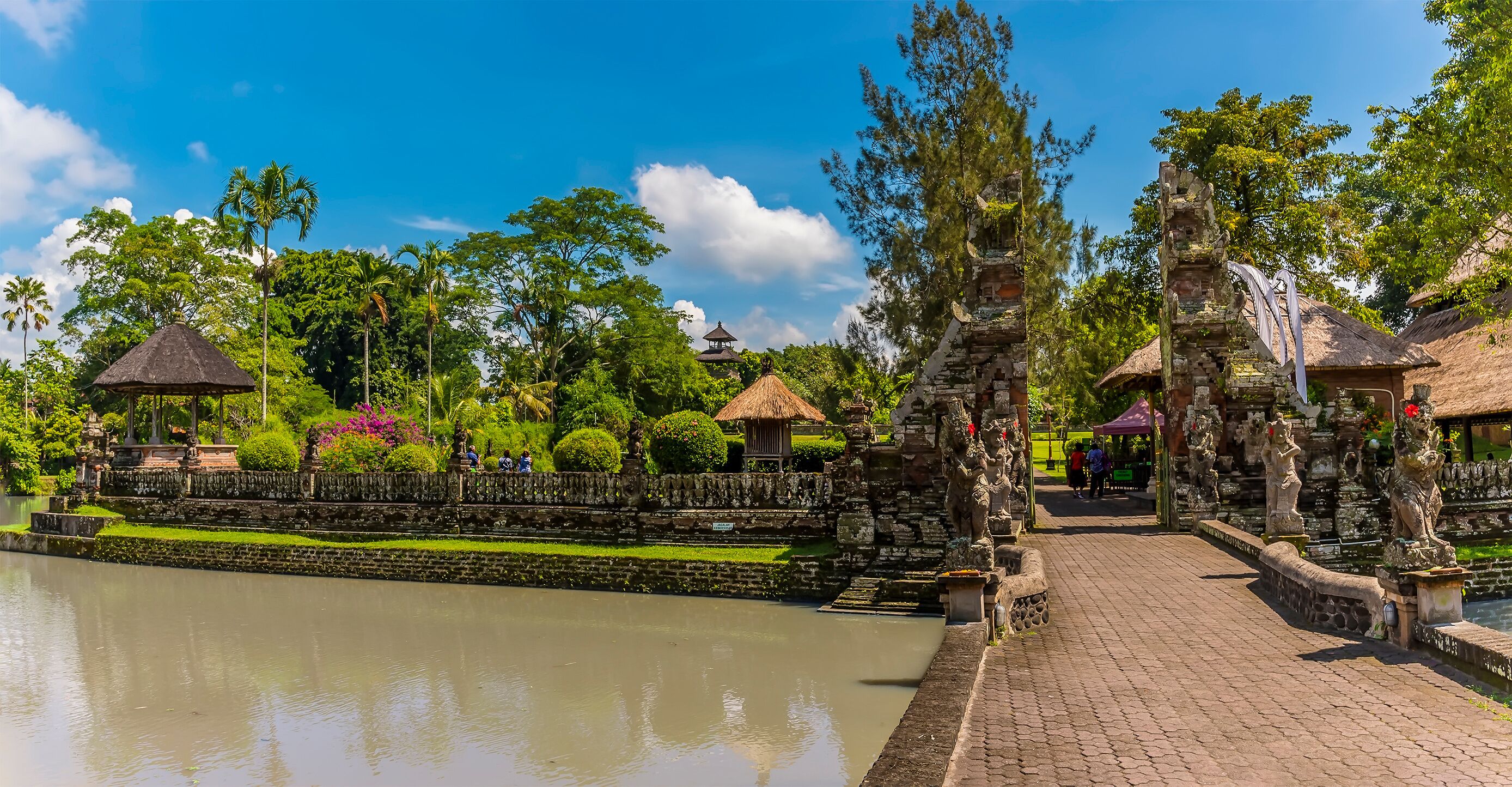 A view across the moat and entrance to the temple of Pura Taman Ayun in the Mengwi district, Bali, Asia