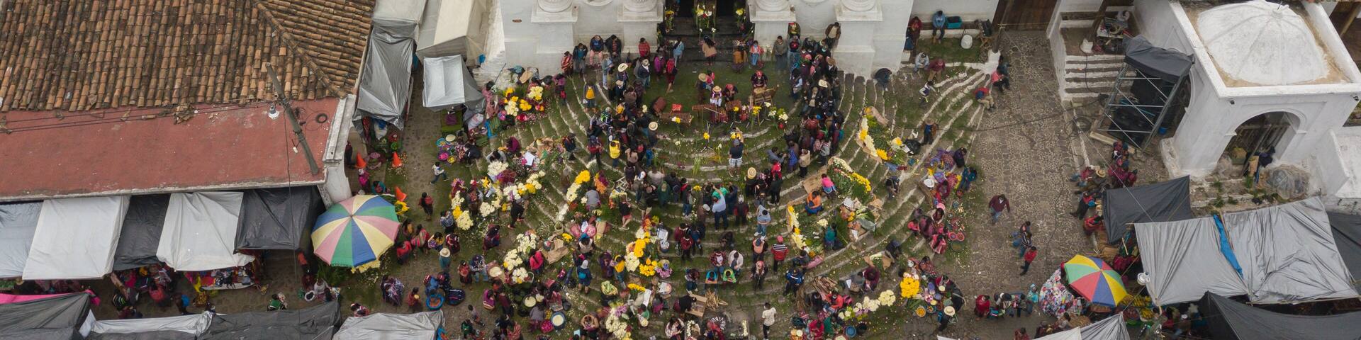 Aerial view of the church in Chichicastenango Guatemala with many people at the entrance.