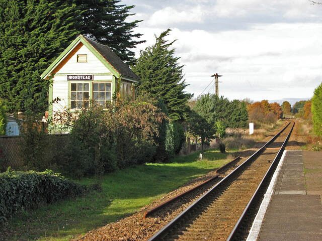 This way to North Walsham And to Cromer and Sheringham beyond. At left the signal box can be seen; it is located in one of the adjoining Station Cottages' garden. The former signal box is located in one of the adjoining Station Cottages' gardens. The line connecting the city of Norwich with North Walsham was opened in 1874 and it reached the seaside town of Cromer by 1877. The rest of the line, between Cromer and Sheringham, opened in 1887. It is the remains of the Midland and Great Northern Joint Railway line (based in Melton Constable), part of which is preserved as a heritage railway, between the coastal town of Sheringham and Holt, further inland. Passenger services are operated by 'One Railway' which is part of the National Rail network, operated by National Express East Anglia and uses Class 150, Class 153, Class 156 or Class 170 diesel multiple units. The line is named after the Bittern (a member of the Heron family), a rare bird which can still be found in Norfolk's wetlands.