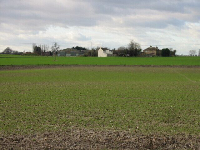 View across farmland to Black Pond Farm.
