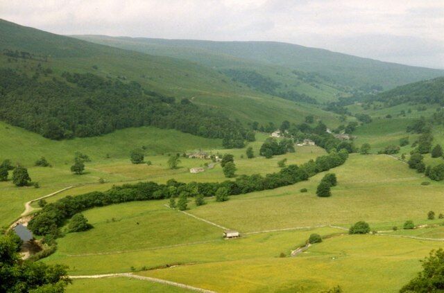 Haw Ings in Wharfedale The flat flood plain downstream from Hubberholme, taken from Buckden Rake. This photo was taken 11 years before that of Tim Cook 57075, from virtually the same spot, and it is interesting to note how some of the streamside and hedgerow trees have grown over that period. Otherwise, there is little change in the landscape.