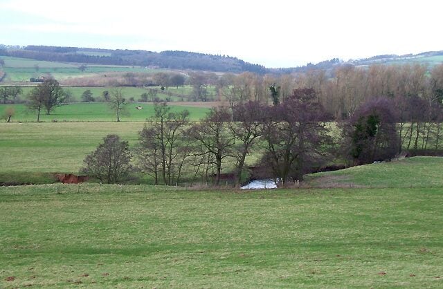 Grazing Land by the River Corve at Lawton, Shropshire The footpath crosses this field down to a footbridge just visible on the far right of the picture.