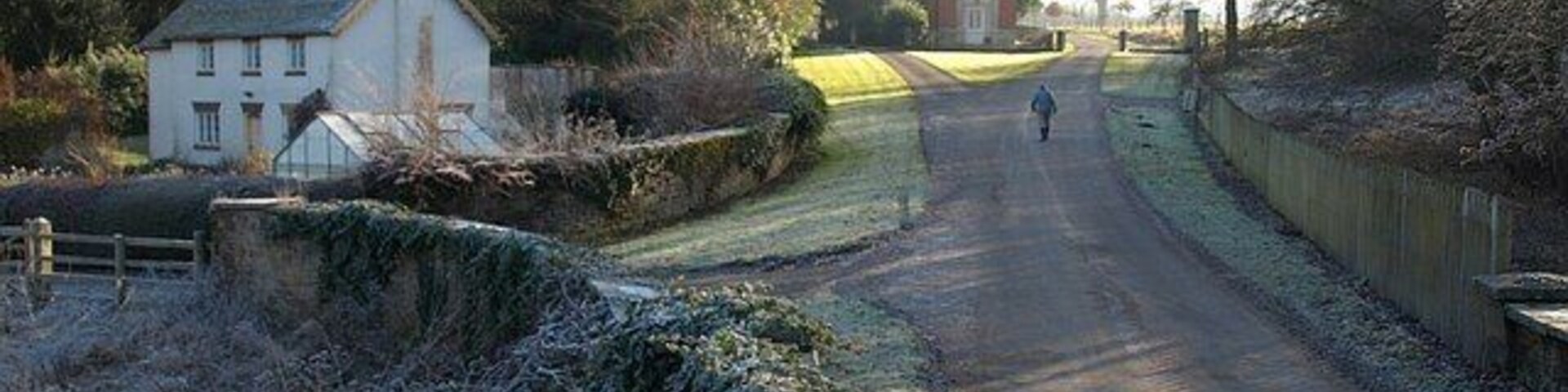 Cottage and lodge, Bromfield. A view from the bridge over the Teme of Mill Cottage, and, some way up the drive, 1117580.