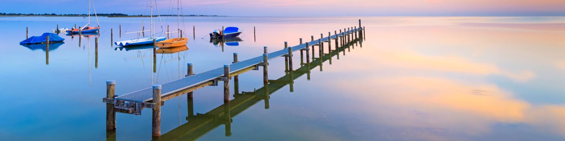 A tranquil and calm summer evening at Lake IJsselmeer near Hindeloopen, The Netherlands; Shutterstock ID 1077461891; Purchase Order: SP-1394 HA Batch 3 Part 1; Order Number: ; Client/Licensee: HomeAwa