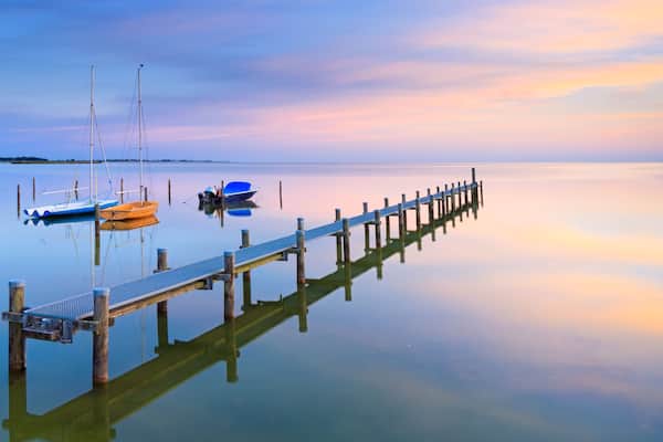 A tranquil and calm summer evening at Lake IJsselmeer near Hindeloopen, The Netherlands; Shutterstock ID 1077461891; Purchase Order: SP-1394 HA Batch 3 Part 1; Order Number: ; Client/Licensee: HomeAwa