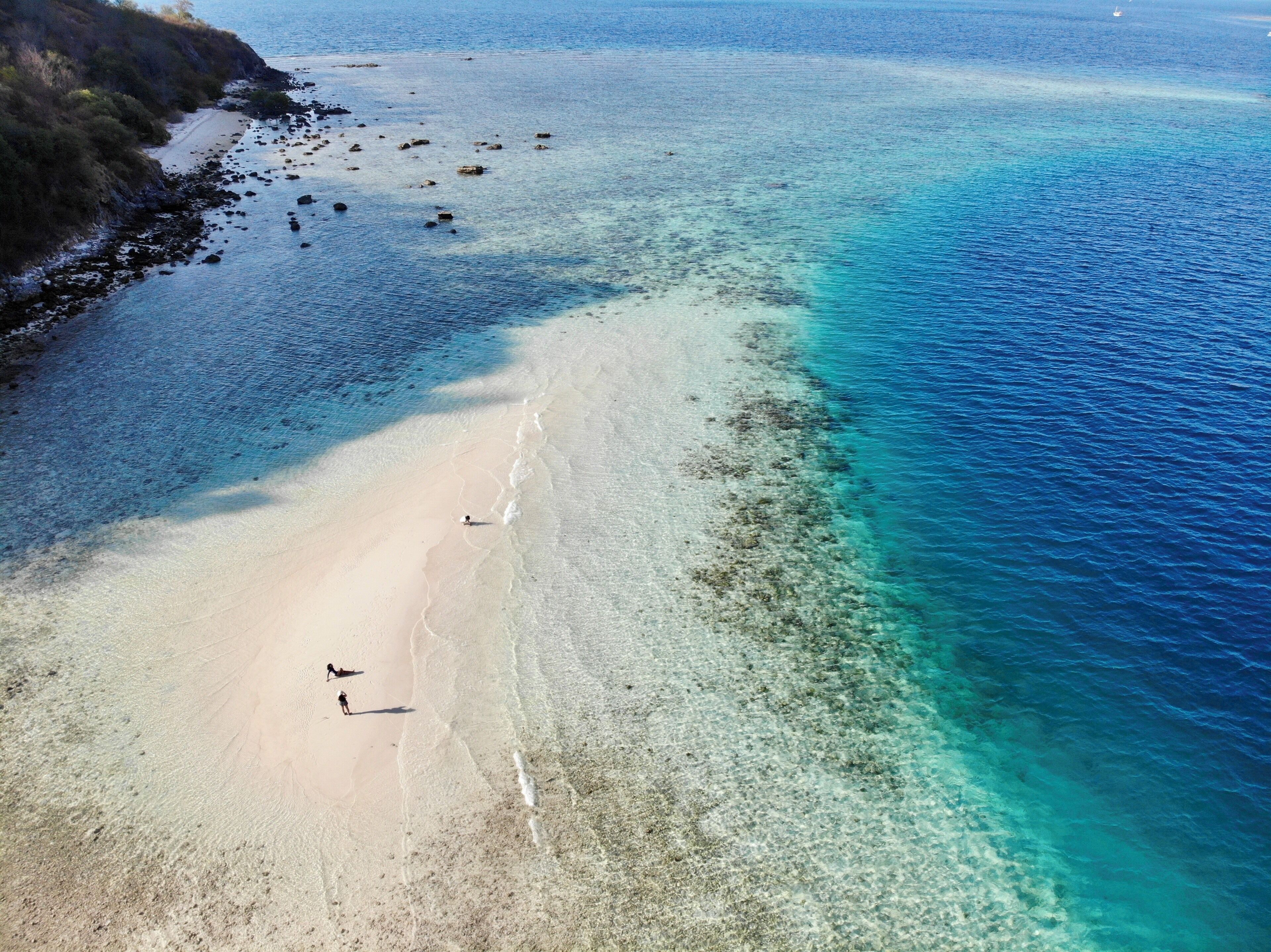 White sand beach and different shades of blue ocean