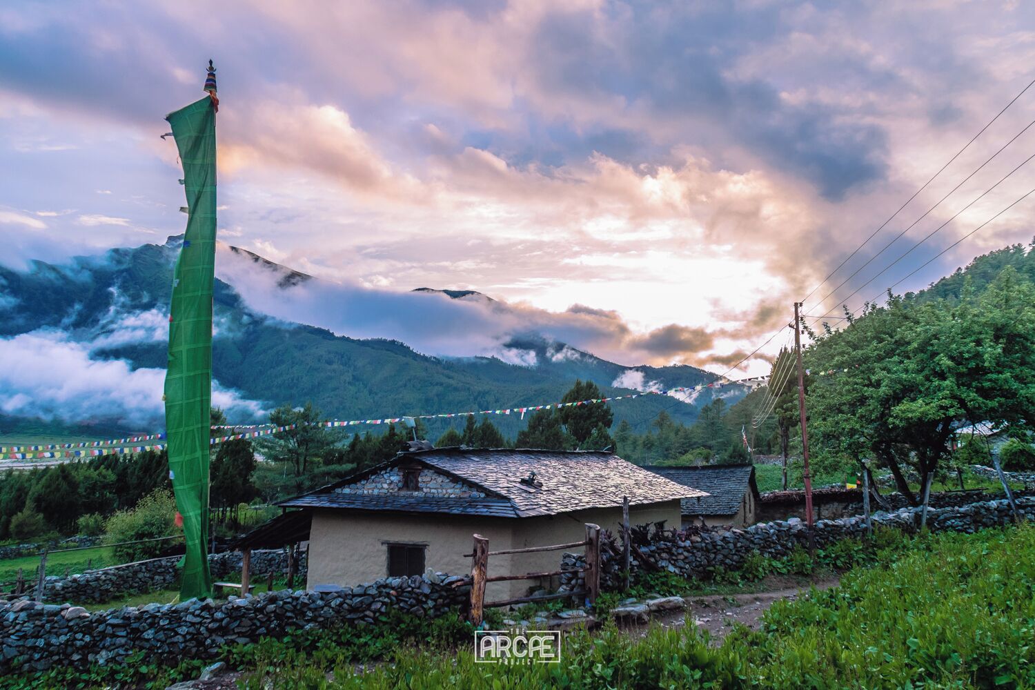 A Tibetan house stands against the sunset in the small village of Dhorpatan on a cloudy afternoon. 