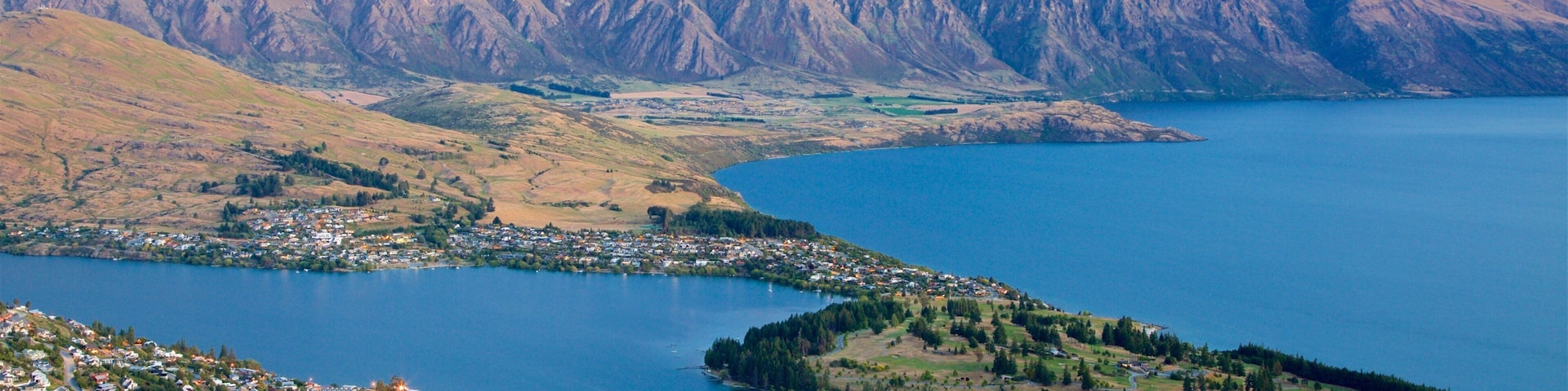 New Zealand featuring a sunset, a lake or waterhole and landscape views