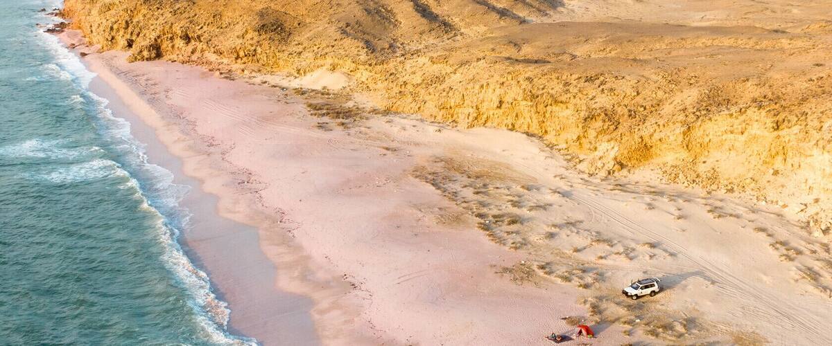 We found this pink beach on a road trip across Oman. This country has been an incredible journey into a world undiscovered by tourism. It is the best road trip country I’ve been to. #hiddengems #oman #pinkbeach