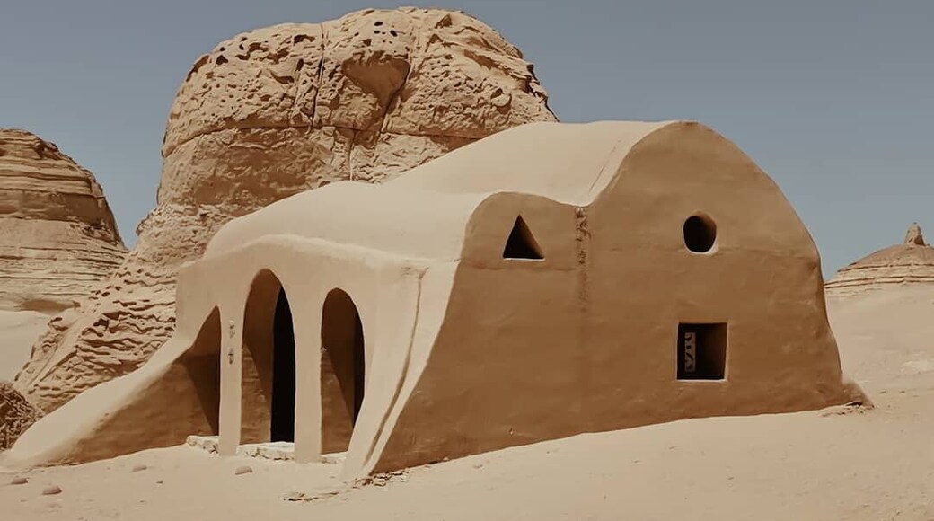 The #history:
The Valley of Whales was once submerged beneath the Terhys Sea. It is now home to an obscure museum which was built around the fossils of the prehistoric whale, Basilosaurus Isis. These fossils show the archaic species to have small hind legs; which supports the evolutionary notion that whales evolved from land based animals to sea dwelling creatures.
What you see in this photo:
Most of the museum is open air but the rest of it is in these structures, designed to mimic their surrounding landscape. You can also see the beauty of the petrified coral on the ambient rock formations.
Travel tips:
You can take a 4x4 tour to this National Park, the ride itself is part of the fun! At the museum make sure you explore the trail and then relax and have tea and snacks in their cafe.
Afterwards, have a BBQ with the locals, go sand surfing, see the Magic Lake and go horse riding as the sun sets! It is a very doable day trip from Cairo, and an unforgettable one for sure.