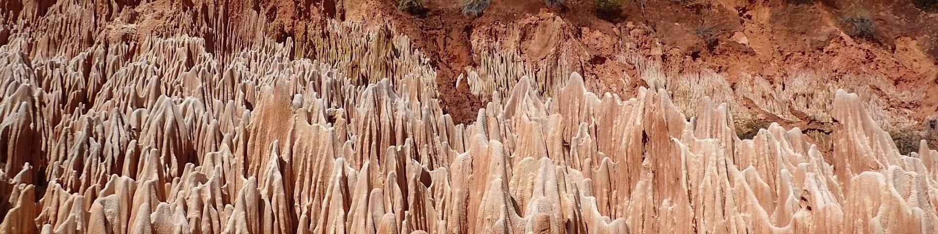 Amazing calcite formations left behind after the red mud has been washed away. You need a good 4x4 and driver to reach it as it takes a serious bit of off-roading to get there. You can also only see them in the dry season as the bottom of the valley is a river at any other time. There is a small place selling food where you park and a toilet!