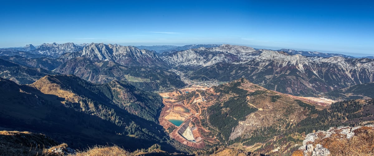 A mountainous landscape with a mining area.