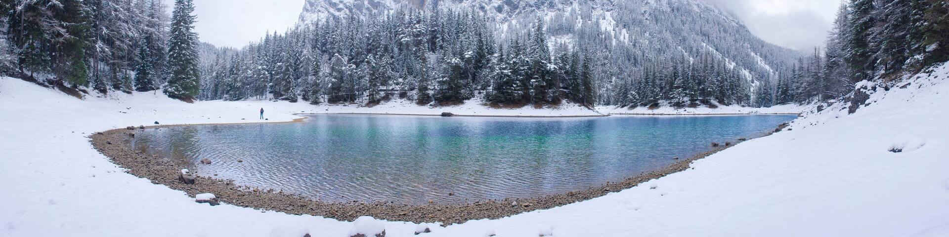Amazing winter landscape with snowy mountains and clear waters of Green lake (Gruner see), famous tourist destination in Styria region, Austria