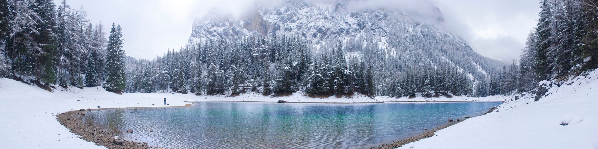 Amazing winter landscape with snowy mountains and clear waters of Green lake (Gruner see), famous tourist destination in Styria region, Austria