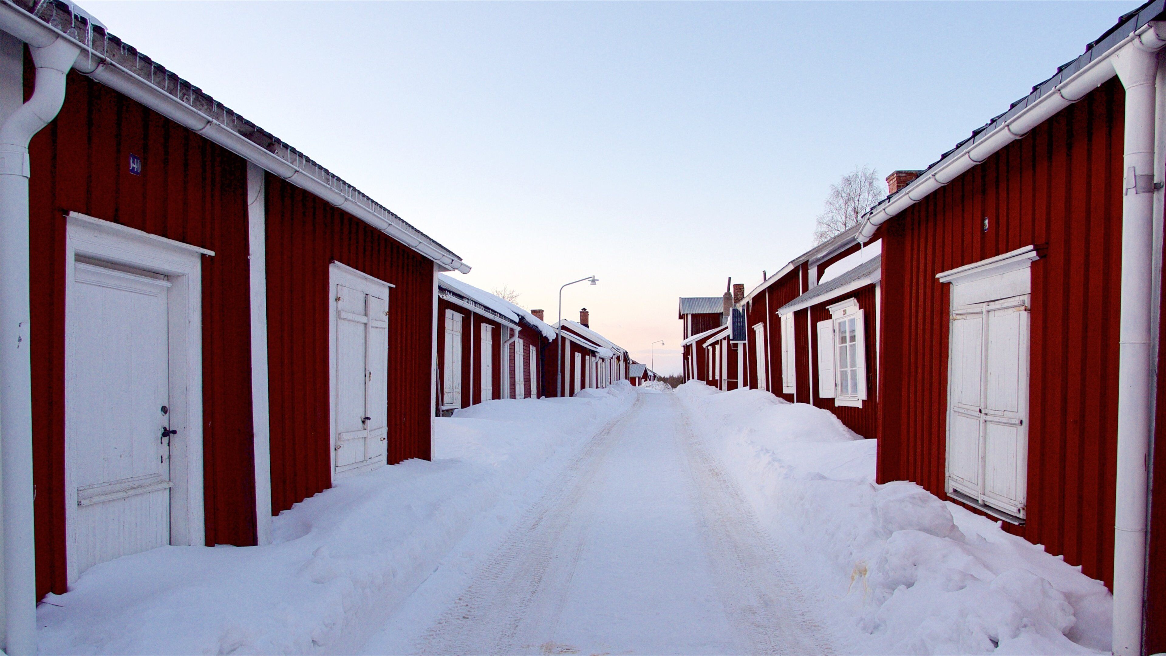 Gammelstad showing a small town or village, snow and a sunset