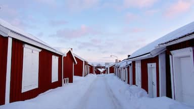 Gammelstad featuring snow, a small town or village and a sunset