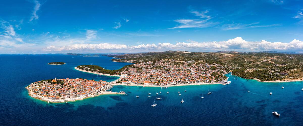 Aerial view of Primosten old town on the islet, Dalmatia, Croatia. Primosten, Sibenik Knin County, Croatia. Resort town on the Adriatic coast. Aerial view of adriatic town Primosten, Croatia