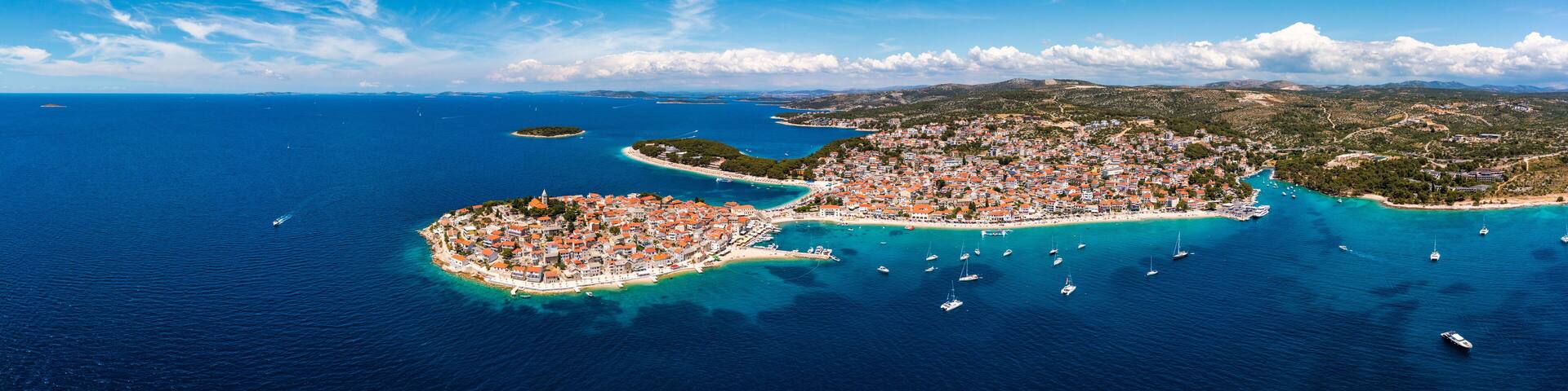 Aerial view of Primosten old town on the islet, Dalmatia, Croatia. Primosten, Sibenik Knin County, Croatia. Resort town on the Adriatic coast. Aerial view of adriatic town Primosten, Croatia