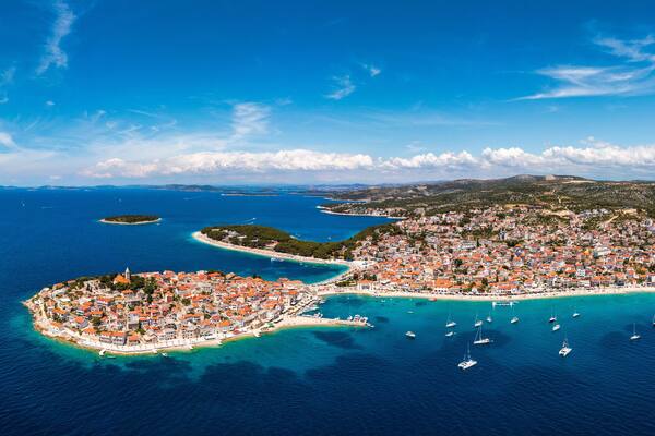 Aerial view of Primosten old town on the islet, Dalmatia, Croatia. Primosten, Sibenik Knin County, Croatia. Resort town on the Adriatic coast. Aerial view of adriatic town Primosten, Croatia