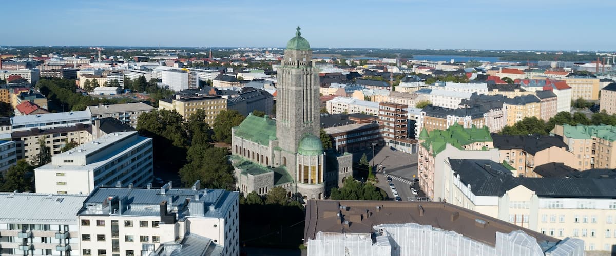 Part of Helsinki city , Kallio church tower in middle. Beautiful summer day, blue sky and clouds