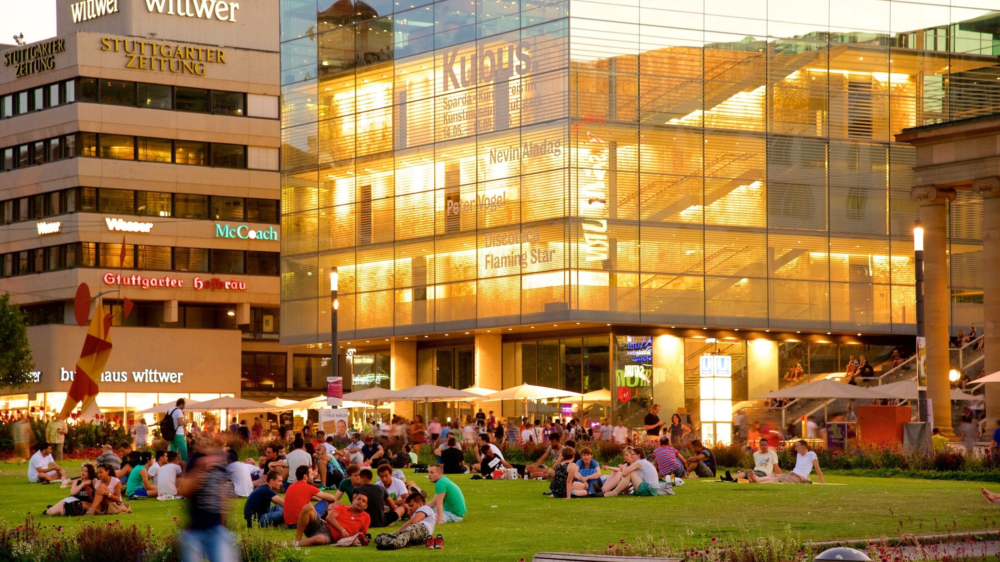 Stuttgart-Mitte featuring a park and modern architecture as well as a large group of people